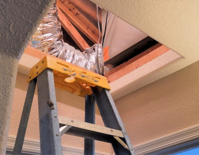 A ladder with a vent on top. A ladder with a vent on top.