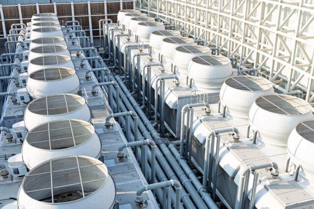 A large white tanks with pipes. A large white tanks with pipes.