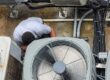 A man working on a machine.