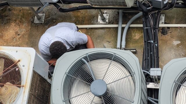 A man working on a machine. A man working on a machine.