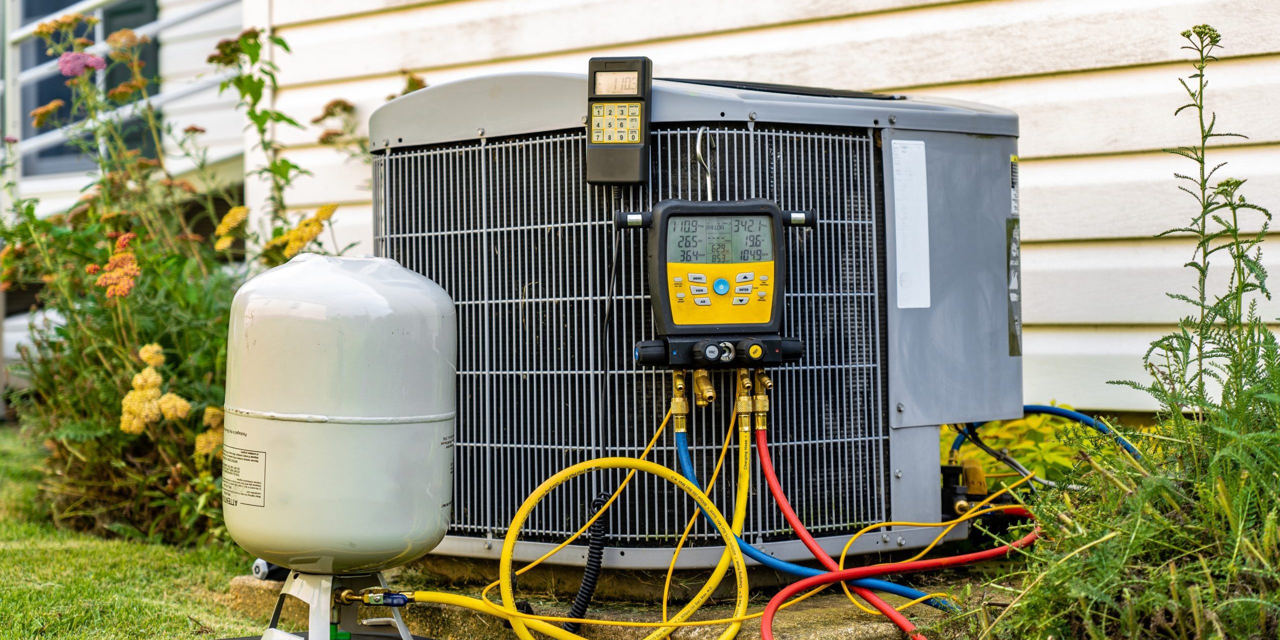 An,Old,Air,Conditioning,Unit,That,Is,Being,Repaired,By