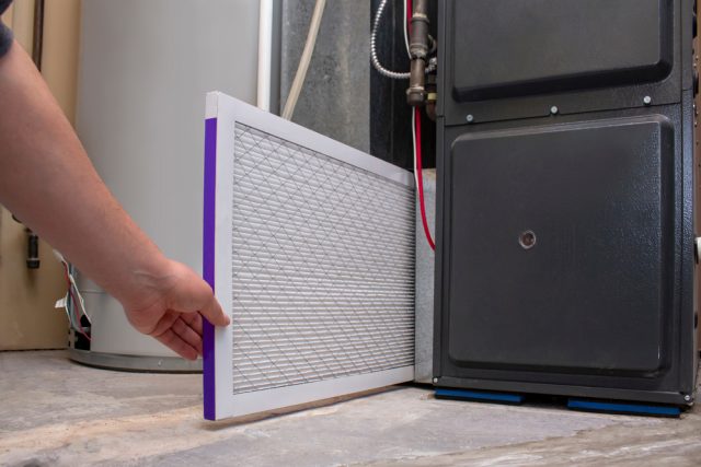 A,Person,Changing,An,Clean,Air,Filter,On,A,High Choosing The Right Air Filter